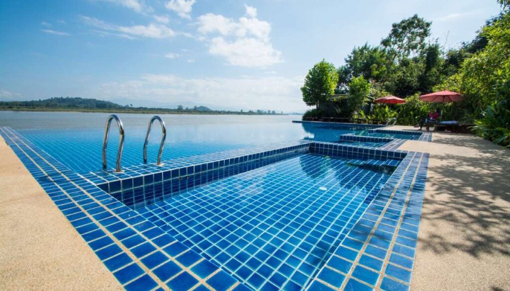 swimming-pool-near-khong-river-with-blue-sky-chiangsan-chiangrai-thailand_0x800