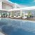 terrace-by-pool-with-sun-loungers-near-modern-house-3d-rendering_0x800
