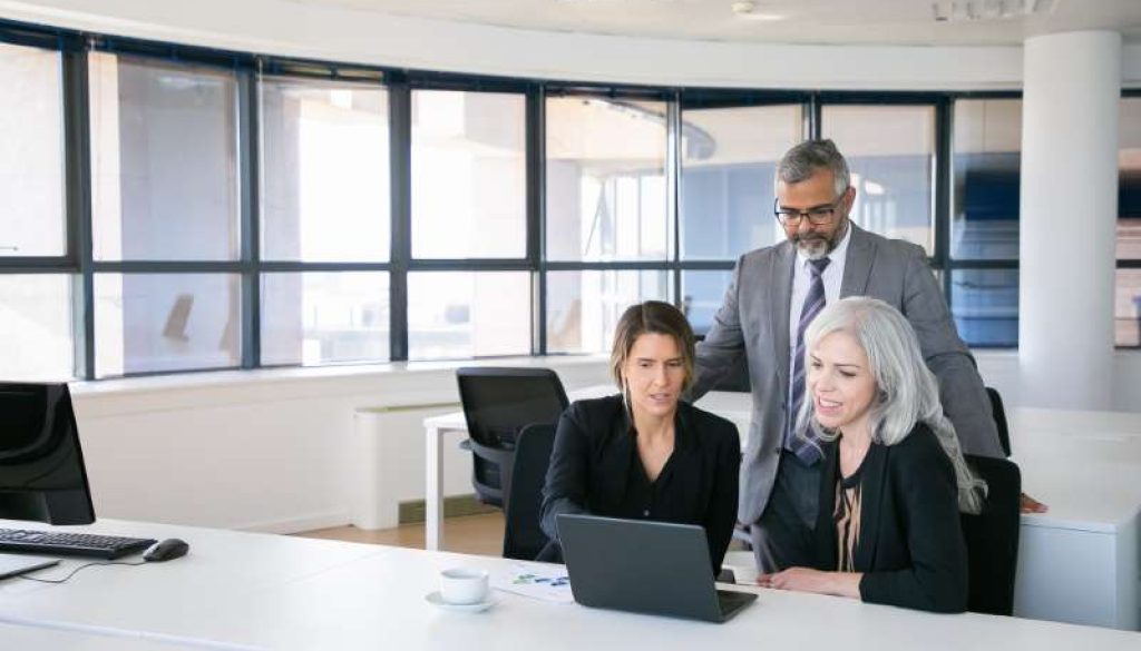 business-team-three-watching-presentation-pc-monitor-discussing-project-sitting-workplace-pointing-display-copy-space-business-meeting-concept_800x600