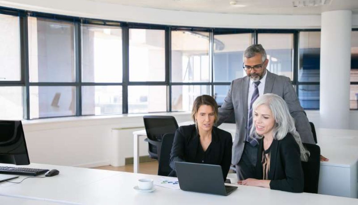 business-team-three-watching-presentation-pc-monitor-discussing-project-sitting-workplace-pointing-display-copy-space-business-meeting-concept_800x600