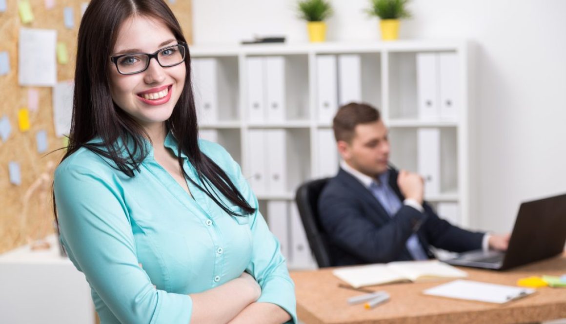 Businessman and businesswoman in office