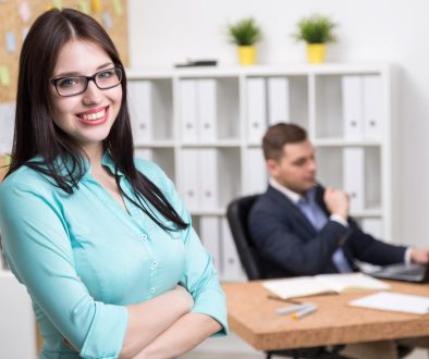 Businessman and businesswoman in office