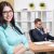 Businessman and businesswoman in office