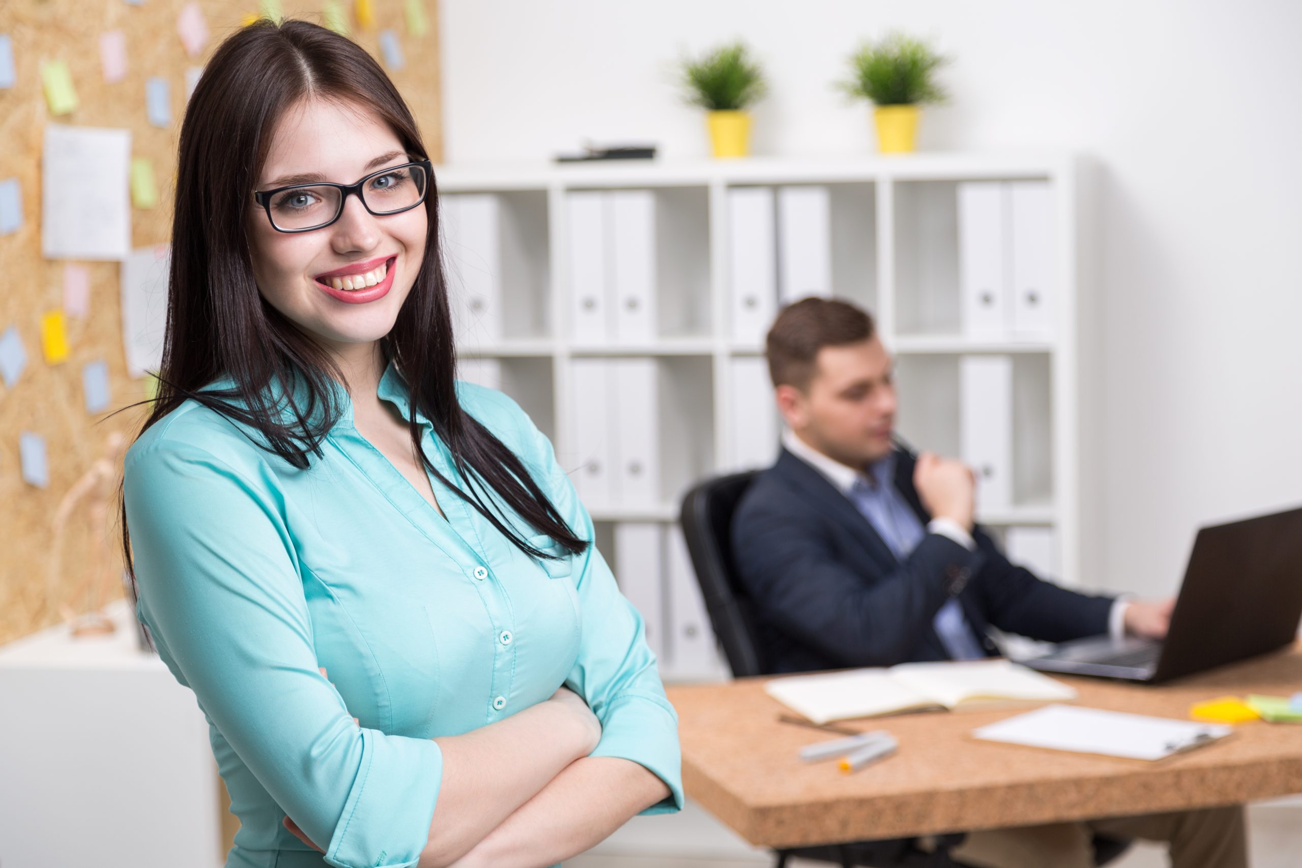 Businessman and businesswoman in office