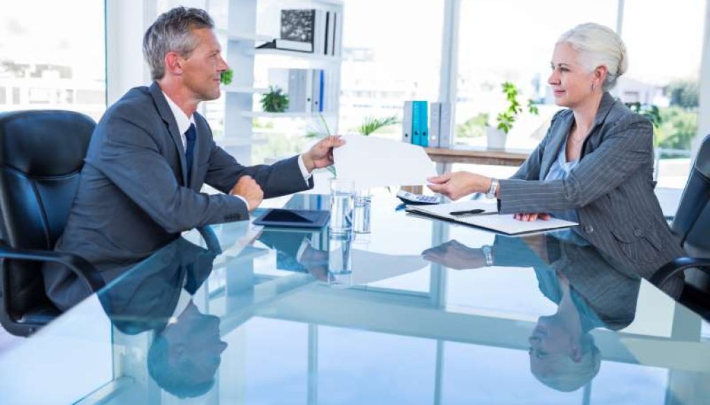 businessman-giving-paper-hos-colleague_800x600