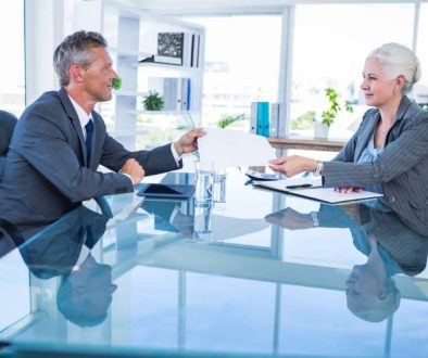 businessman-giving-paper-hos-colleague_800x600
