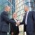 Confident middle-aged businessmen greeting each other