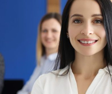 Confident people posing in company office