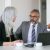 couple-serious-colleagues-sitting-table-with-laptop-documents-cups-coffee-talking-medium-shot-teamwork-communication-concept_800x600