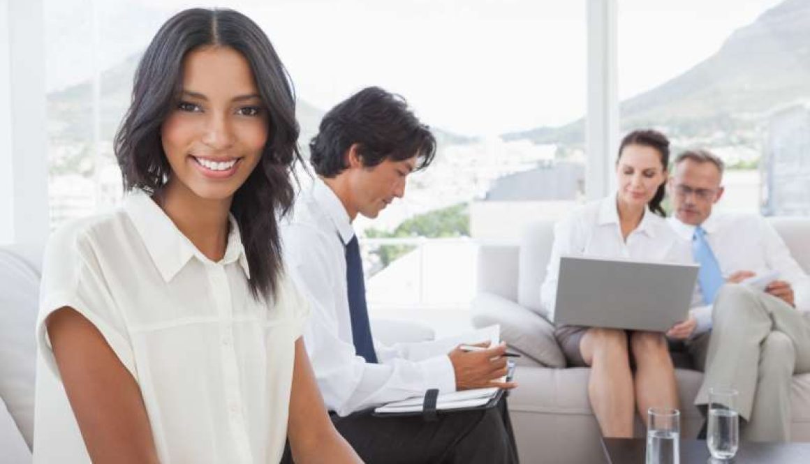 smiling-businesswoman-with-work-colleagues_800x600