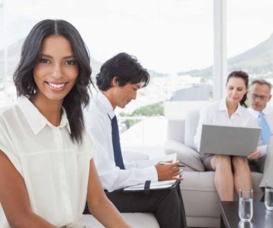 smiling-businesswoman-with-work-colleagues_800x600