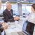 smiling-senior-man-shaking-hands-with-young-businesswoman-office_800x600