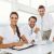 three-smiling-business-people-office-desk_800x600