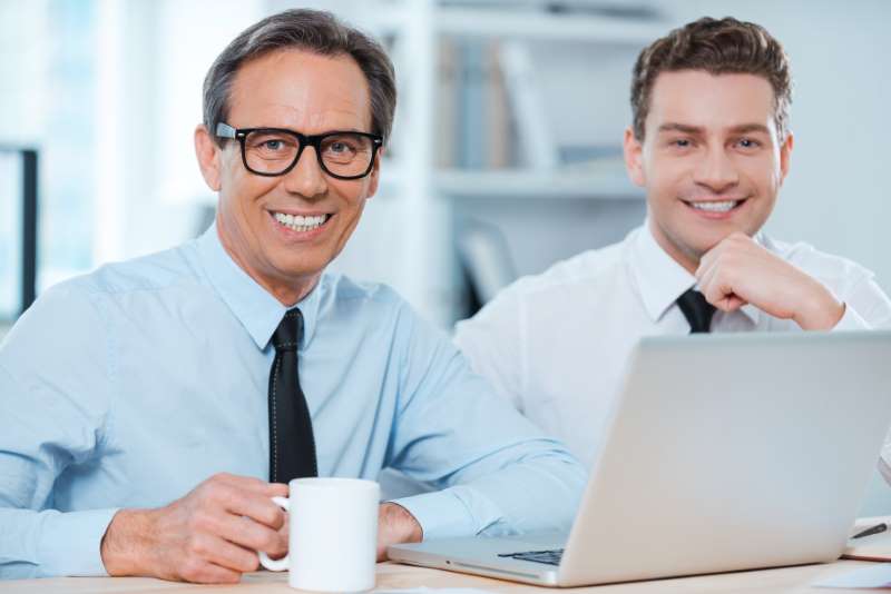 two-professionals-work-two-cheerful-business-people-formalwear-working-laptop_800x600